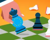 Una mano tiene un pedone degli scacchi con il simbolo dell'UE, mentre altri pedoni cadono. Rappresenta il concetto di autarchia significato.